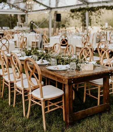 Special Event Rentals tables and chairs in a wedding reception with