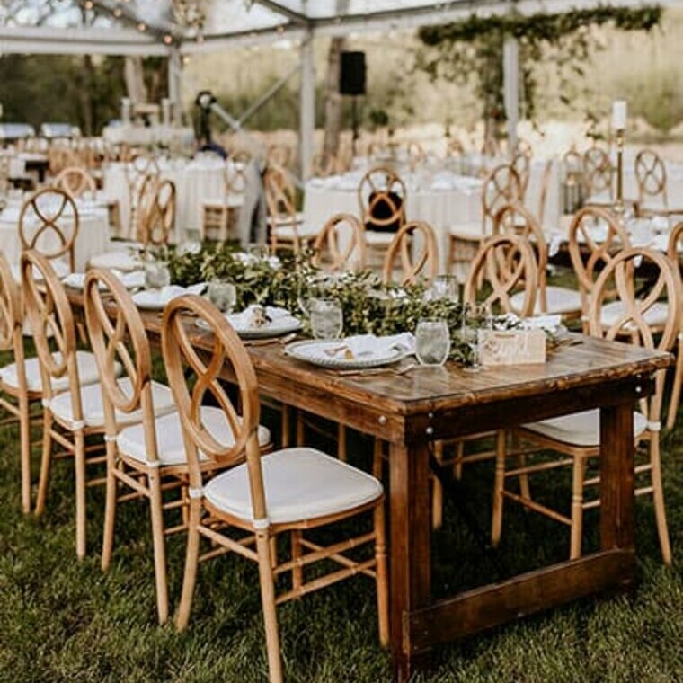 Special Event Rentals tables and chairs in a wedding reception with